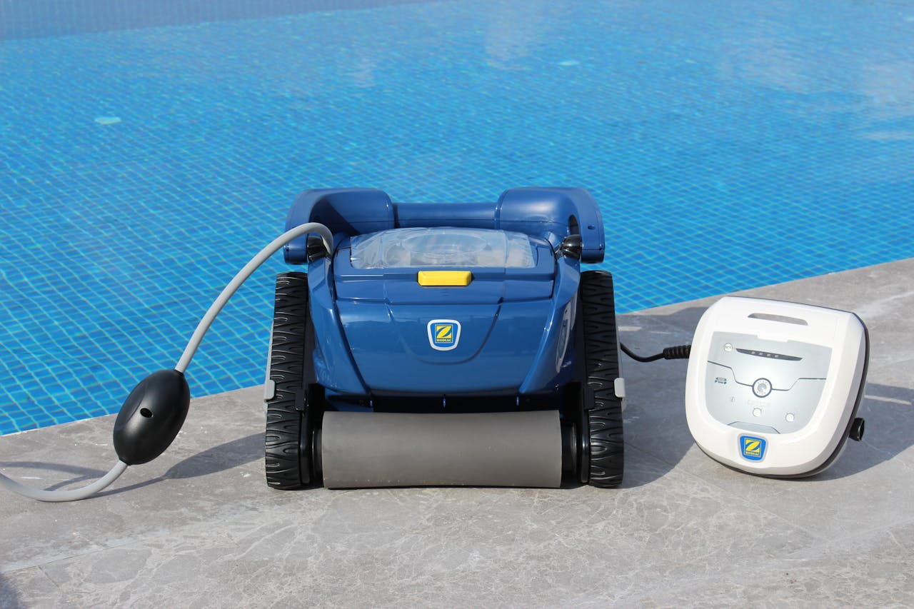 Robotic pool cleaner on pool edge in Bodrum, Turkey. Efficient and modern.